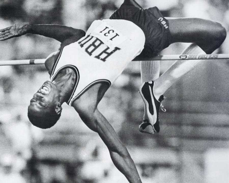 An athlete performs a Fosbury Flop during high jump on HCU campus, celebrating 60 years of the technique in competition.