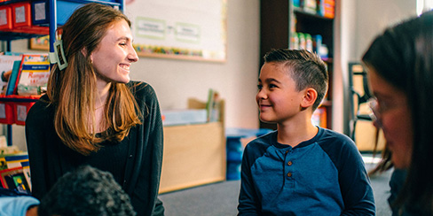 Teacher smiling at a student