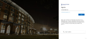 my.HC.edu portal login page with access fields and HCU campus buildings illuminated against the night sky in the background.