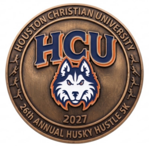 Bronze Houston Christian University 26th Annual Husky Hustle 5K medallion with the HCU husky mascot logo.