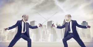 Two people in suits and fencing masks duel with swords on HCU campus, city skyline and cloudy sky in the background.