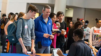 Career fair recruiter and student line.