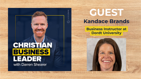 Darren Shearer and Kandace Brands discuss Christ-Centered Business Leaders; their photos displayed on HCU campus backdrop.