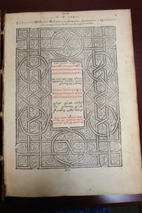 Title page of an early printed Bible with decorative illustrations and text
