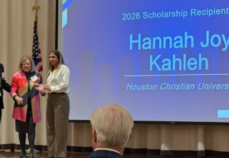 Hannah Joy Kahleh is announced as 2026 Scholarship Recipient on stage, joined by two others, celebrating connection at HCU.