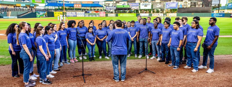 HCU Choirs performing the National Anthem at the Sugar Land Space Cowboys baseball game