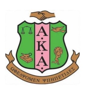 Alpha Kappa Alpha pink and green shield logo with “By Culture and By Merit” banner, on HCU campus.