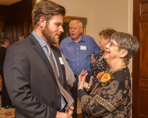 Warren greeting one of her former students