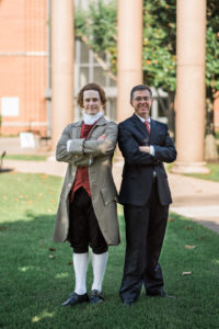 Steve Edenbo portraying Thomas Jefferson in historical costume stands beside Dr. Chris Hammons